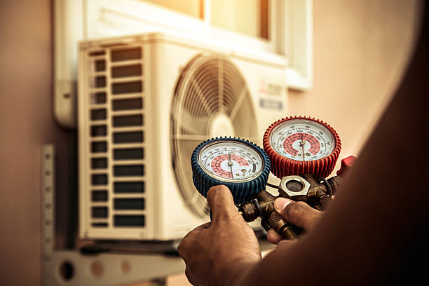 Professional Heat Pump Repair technician working in Lamont, MI
